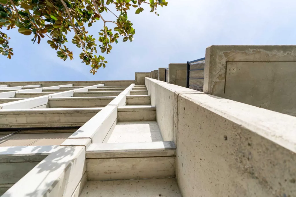 Concrete side of a building with balconies that was a project consulted by leading resilience advisor San Francisco.